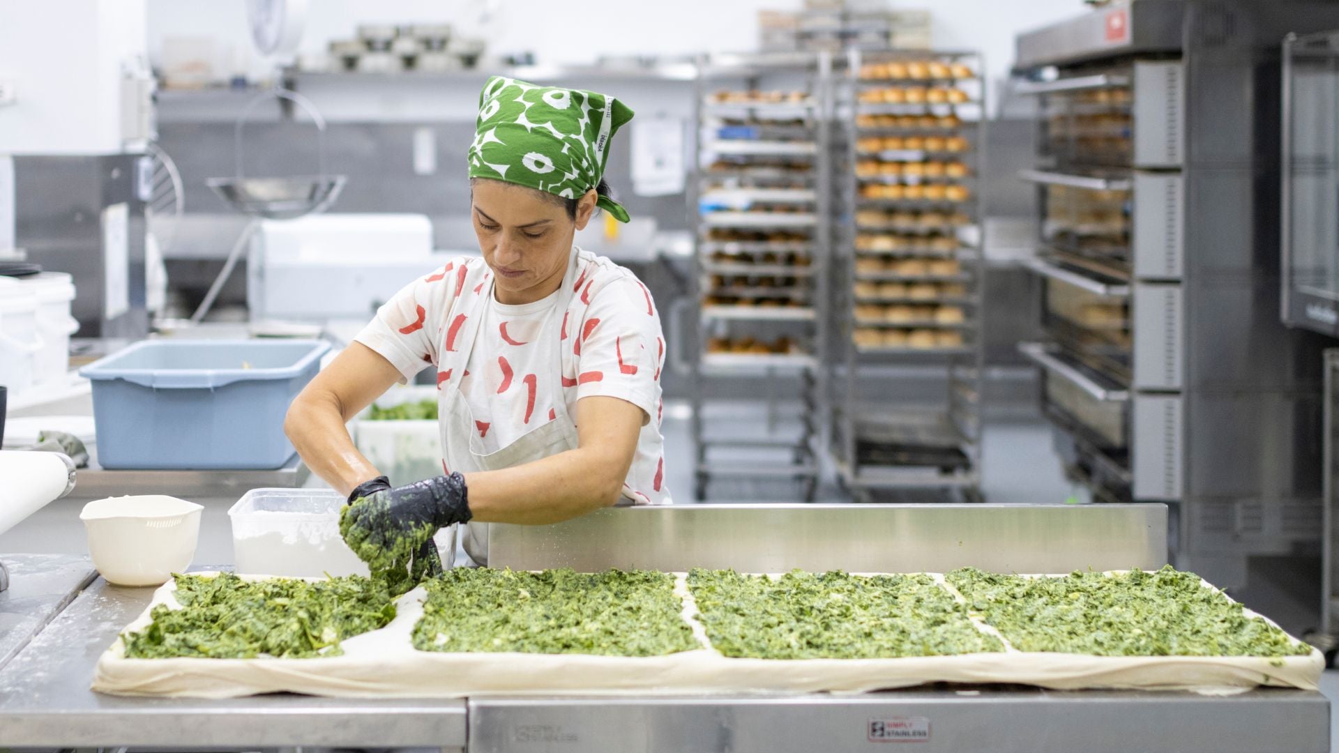 Toula making her famous spanakopita at Candied Bakery